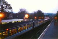 A southbound service, made up of 158 and 156 units, calls at Pitlochry on a May evening in 1995. This was the last station in Scotland to have tungsten lighting.<br><br>[David Panton /05/1995]