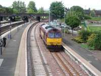 60031 comes off the Alloa line and runs light through Platform 9 at Stirling, presumably on a crew training run. The loco had followed the 1541 Alloa to Glasgow service along the new line. <br><br>[Mark Bartlett 29/05/2008]