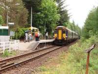 156474 at the head of a four car train calls at Tyndrum Lower to pick up a reasonable number of passengers on the morning Glasgow to Oban service on 30 May. A new shelter, nearer the platform entrance, has been installed since picture 3607 was taken in 2005.<br><br>[Mark Bartlett 30/05/2008]
