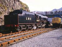 LMS 5025 taking water at Kyle of Lochalsh 25 September 1982 standing alongside 37184 which took the train back to Inverness.<br><br>[Peter Todd 25/09/1982]