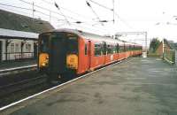 A Glasgow Central service stops at Prestwick Town in October 1998 formed by 318 260.<br><br>[David Panton /10/1998]