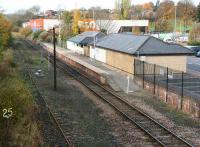 Scene at Bishop Auckland in 2007, now a terminus at the end of a single line section. Northern Rail provides services from here, running to Saltburn via Darlington and Middlesbrough. The overgrown line on the left is the old Crook and Wearhead line, with the former closed in 1965 from Wear Valley Junction and the latter now a preserved line in the hands of the Weardale Railway . The land once occupied by the large original station is now covered by roads, car parks and retail developments.  <br><br>[John Furnevel 04/11/2007]