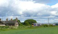 The ruinous Inchture station is passed by a First ScotRail 170 forming the 1240 Glasgow - Dundee. The station closed to passengers in 1964<br><br>[Brian Forbes 11/06/2008]