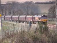 A look back to the first coal train running from Hunterston to Longannet. My dad Brian Forbes handed me a little camera, this is the result. 66083 I think.<br><br>[David Forbes ?/04/2008]