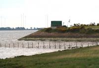 Remains of the embankment that once formed part of the northern approach to the Solway Viaduct, photographed looking west on 21 May 2008. The green building contains equipment associated with the waste water pipeline from Chapelcross, seen entering the picture centre right. <br><br>[John Furnevel 21/05/2008]