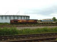 EWS 66107 is seen arriving in Millburn Yard, Inverness, on 16 June 2008 with a train of ballast hoppers.<br><br>[John Gray 16/06/2008]