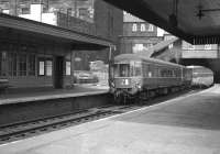 A DMU from Waverley leaves Abbeyhill on a service to Musselburgh in June 1963 and is just about to pass below the station booking office on London Road.<br><br>[Colin Miller 01/06/1963]
