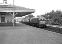 NBL Type 2 D6148 arrives at Ellon with a northbound train in July 1963.<br><br>[Colin Miller /07/1963]