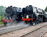 A World War II US Army Transportation Corps S160 class locomotive stands alongside BR 9F 92203 <I>Black Prince</I> at the East Somerset Railway 150 Gala day at Merehead Quarry on 21 June 2008.<br><br>[Peter Todd 21/06/2008]