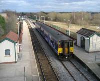 150 269 arrives at Lostock Hall on 18 March with a Colne - Blackpool South service. The site of Lostock Hall shed is on the right.<br><br>[John McIntyre 18/03/2008]