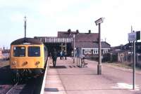 A DMU for Sheringham stands at Cromer (formerly Cromer Beach) in June 1979, with the station canopy still in place.<br><br>[Ian Dinmore 08/06/1979]