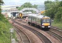 A Waverley bound train runs down the gradient towards Dalmeny North Junction on 26 June 2008, while in the background a 158 stands at the northbound platform of Dalmeny station with a service for Fife.<br><br>[John Furnevel 26/06/2008]