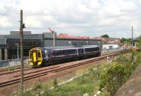 A Dunblane bound train shortly after leaving Larbert on 3 July 2008, passing the new Network Rail training centre, officially opened the previous week.<br><br>[John Furnevel 03/07/2008]
