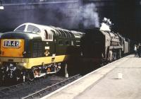 Deltic D9003 <I>Meld</I> stands alongside an unidentified Britannia Pacific at Kings Cross circa 1962.  [Photo by the late Dave Gordon.]<br><br>[Dave Gordon collection (Courtesy Colin Alexander) //1962]