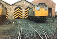 Scene at Inverness shed on 27 March 1982, with 27102 partially in shot on the left, 27203 in the centre and an unidentified class 47 peeping out from behind the shed wall in the right background.<br><br>[Colin Alexander 27/03/1982]