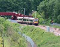 The 1018 service from Glasgow Queen Street seen on 12 June 2008 approaching the footbridge that replaced the level crossing at Alloa West.<br><br>[John Furnevel 12/06/2008]