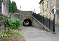 Looking north on 2 July 2008 along the route of the Alloa Wagonway running below Bedford Place towards the Drysedale Street/Mar Street underpass in the distance. To the right is the ramp up to street level, above which can be seen a statue of St Margaret standing over the Alloa War Memorial in its walled garden of remembrance on Bank Street. The memorial was unveiled by Field Marshall Earl Haig himself in 1924. <br><br>[John Furnevel 02/07/2008]