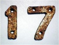 This <i>17</i> plate was in the Tamshill tunnel northwards from former Maryhill [Barracks] Station to Possil Station, Glasgow. They were a distance of 1 chain apart, showing the distance through the tunnel to assist rail staff. Other signs seen were <i>7</i>, <i>14</i> and <i>21</i>.<br><br>[Alistair MacKenzie 12/12/1979]