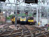 43166 of CrossCountry majestically passes a Class 156 and 314209 as they await signals at Bridge Street on 26th June<br><br>[Graham Morgan 26/06/2008]