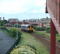 Approaching Blackpool Pleasure Beach from Squires Gate is 150207 on a service from Colne. This is the last station before the terminus at Blackpool South.<br><br>[Mark Bartlett 12/06/2008]