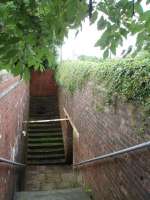 Bay Horse is a very rural location and the still open subway under the line is an unusual survivor. This is the up side showing the subway entrance and also the former access to the up platform, now bricked up. <br><br>[Mark Bartlett 14/07/2008]