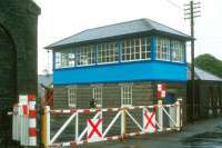 Level crossing and signal box at Athenry on the Dublin - Galway main line on a rainy day in 1988.<br><br>[Bill Roberton //1988]