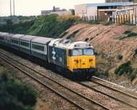 50016 <I>Barham</I> passes the site of Carn Brea station (closed 1961), on the Great Western main line between Camborne andRedruth, with an up servicecirca 1986.<br>
<br><br>[Colin Alexander //1986]