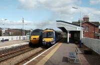 Passing services at Stonehaven on 2 April 2008, with an Aberdeen bound HST alongside 170 428 on a service to Edinburgh.<br><br>[David Panton 02/04/2008]
