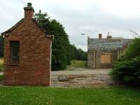A siding ran between the two buildings. The smaller one on the left appears in many photographs and seems to be a gate keepers office for the distillery.<br><br>[John Gray 26/07/2008]