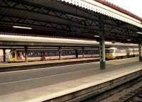 Looking north across the platforms at the west end of Reading station on 26 January 1990. A 117 DMU is boarding in one of the bays as an InterCity 125 HST starts to move off on the final leg of its journey to Paddington.<br><br>[John McIntyre 26/01/1990]