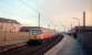 303 064 heading for Airdrie at Partick as the sun sets.<br><br>[Ewan Crawford //1987]