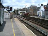 The level crossing and signal box at Bamber Bridge looking East along the platforms on 18 March 2008. Although the signals in the area are now controlled from Preston Signalling Centre, the box remains here to operate the busy level crossing.<br><br>[John McIntyre 18/03/2008]