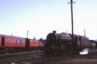 Black 5 no 45134 ambles past the breakdown train in the yards at Carnforth on 13 June 1968.<br><br>[John McIntyre 13/06/1968]