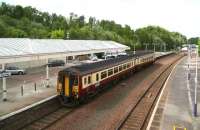 The 1239 Newcastle - Stranraer train heads north away from Dumfries and towards Kilmarnock on 20 May 2008. To the left are the infilled bays that once accommodated direct services to Stranraer running along the former <I>Port Road</I> via Castle Douglas and Newton Stewart.<br><br>[John Furnevel 20/05/2008]