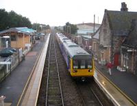 Passengers, some returning from the Open Golf at Royal Birkdale, alight from a Southport to Manchester Victoria service at a dreich Burscough Bridge station on the Southport - Wigan line on 18 July. Looks like a pair of donkeys have escaped from the beach at Southport! <br>
<br><br>[John McIntyre 18/07/2008]