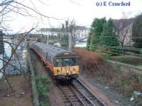 Last Blue Train heads east just east of Helensburgh Central.<br><br>[Ewan Crawford 30/12/2002]