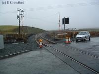 Woodend Level Crossing looking west after re-instatement of the track but before opening.<br><br>[Ewan Crawford //]