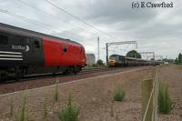 On the new alignment at Prestonpans a locomotive hauled North Berwick service (left) heads for Edinburgh and HST heads east (right).<br><br>[Ewan Crawford //]