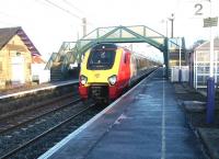 A Virgin Voyager Cross Country service runs west through Prestonpans in January 2003 heading for Waverley.<br><br>[John Furnevel 29/01/2003]