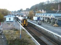 A chilly Dingwall station looking south on a November morning in 2003. The area beyond the abandoned platform (left) on the east side of the station is in danger of becoming a rubbish dump.<br><br>[John Furnevel 23/11/2003]