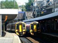 Scotlands busiest mainline platforms? Haymarket station platforms 3 and 4 in May 2004, with ScotRail 158s standing side by side in the sunshine.<br><br>[John Furnevel 17/05/2004]