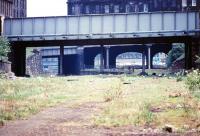 Looking west towards Princes Street in May 1970 along the former Caley trackbed with Grove Street bridge nearest the camera and the tenements of Gardner's Crescent beyond. The lines to the left ran into Princes Street station and to the right Lothian Road goods. The route was later to become Edinburgh's Western Approach Road.<br><br>[John Furnevel 26/05/1970]