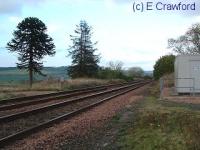 Looking north at Dunning. The signalbox was located to the left by the monkey puzzle tree.<br><br>[Ewan Crawford //]