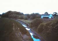 View west from the road bridge over the remains of Aberlady station in 1985 prior to the site becoming part of a caravan park.<br><br>[David Panton //1985]