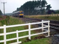 Edinburgh to Dundee class 170 unit heading north passing Sweetholm Crossing in a downpour.<br><br>[Brian Forbes 09/08/2008]
