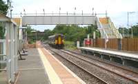 A Carlisle - Glasgow Central train arriving at Gretna Green on 11 August 2008 with the new down platform now operational. Work still to be completed at the recently extended station includes installation of permanent lighting and the fitting of ramps to the footbridge.<br><br>[John Furnevel 11/08/2008]