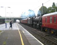 An ECS movement in connection with the <I>15 Guinea special</I> railtour, with 48151 and 70013, together with their support coaches, heading south from Carnforth destined for an overnight stop in Manchester. The train is seen passing south through Leyland on 9 August 2008.<br>
<br><br>[John McIntyre 09/08/2008]
