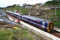 Ongoing work at Livingston North on 14 August 2008 as a 4-car 158 combination pulls out with the 1218 Waverley - Bathgate service.<br><br>[John Furnevel 14/08/2008]
