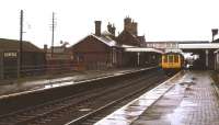A cold, wet Wednesday afternoon at Sleaford station in February 1974, as a DMU prepares to leave on a service to Nottingham.<br><br>[Ian Dinmore 03/02/1974]