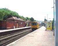 Hall Road station looking towards Liverpool as a Southport service with 507017 pulls in over the level crossing. A short walk from the station is the Mersey estuary and promenade. <br><br>[Mark Bartlett 13/08/2008]